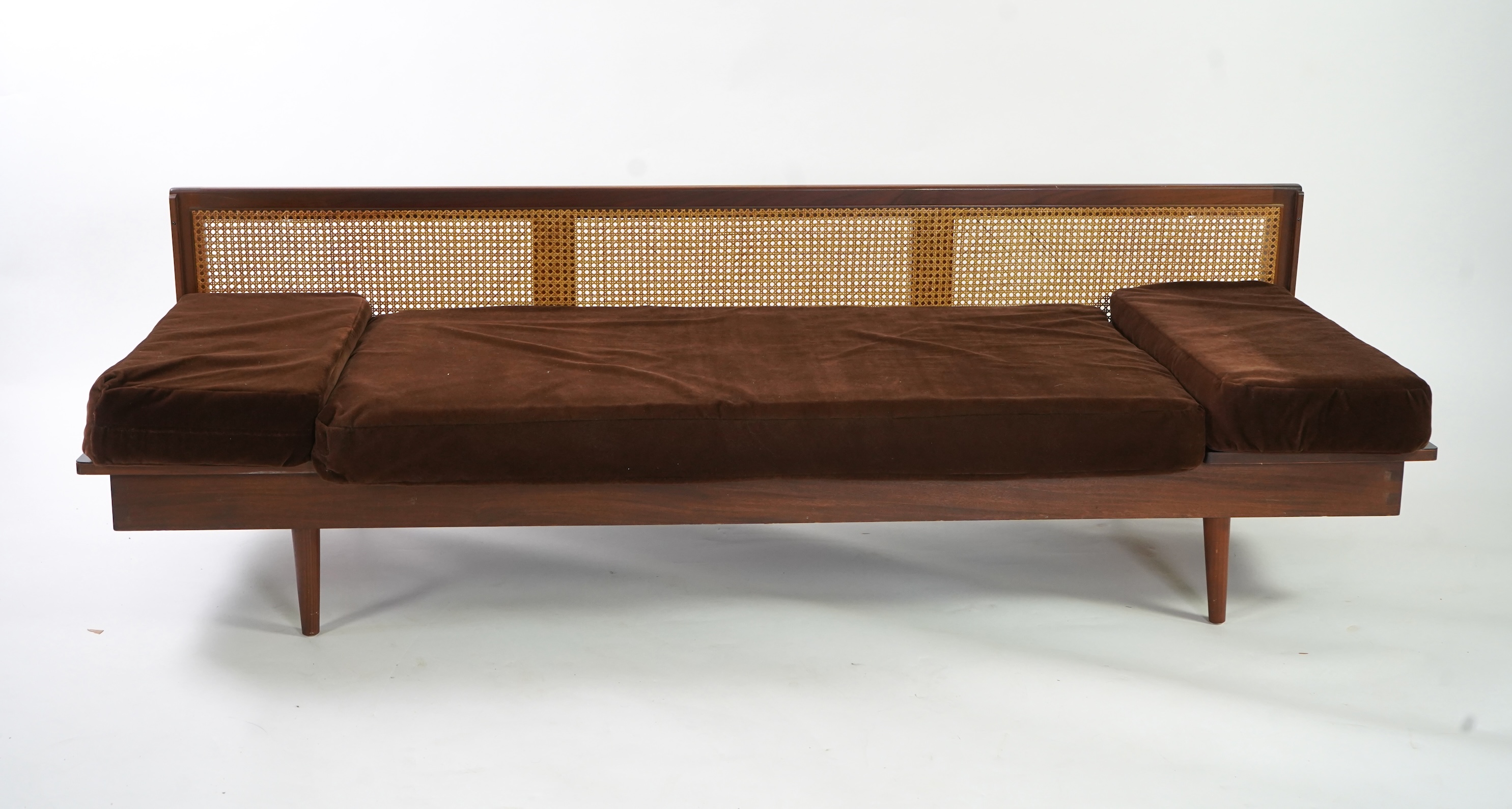 Dennis Young (British): A caned teak sofa/daybed